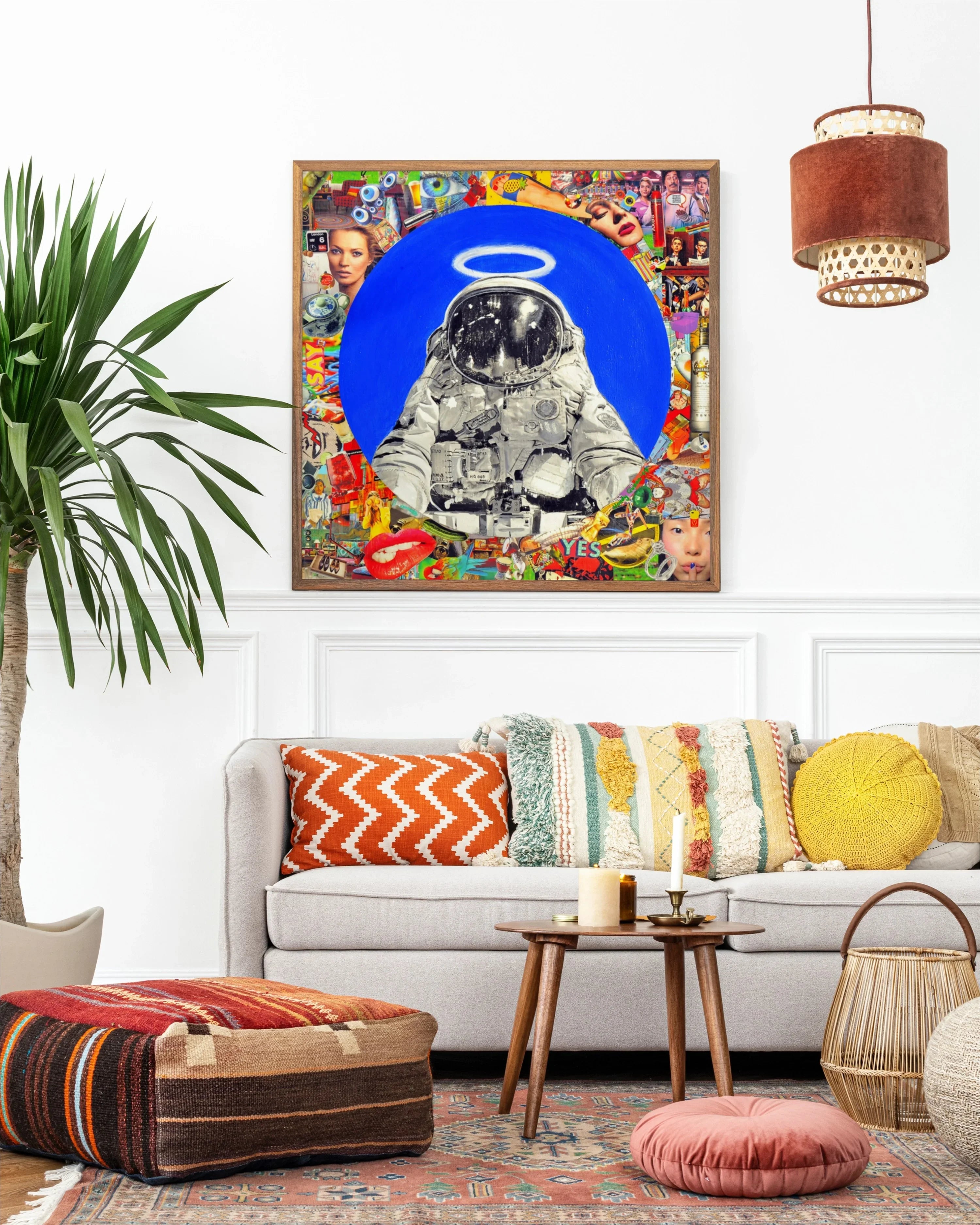 Living room with modern beige sofa, colorful cushions, wooden coffee table, boho decor, and astronaut collage artwork