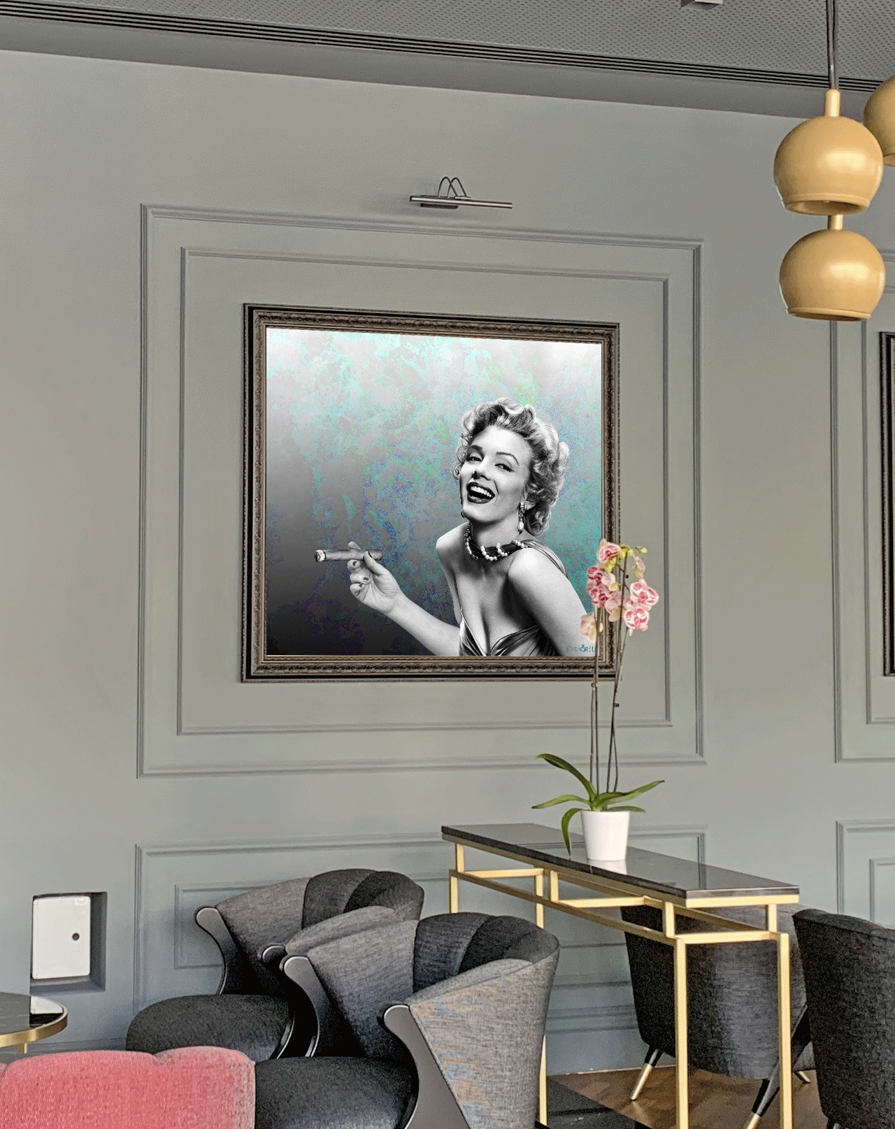 Modern lounge interior with framed black and white Marilyn Monroe portrait, gray chairs, and pink orchids
